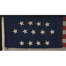 ENTIRELY HAND-SEWN, 13 STAR, U.S. NAVY SMALL BOAT ENSIGN WITH A 4-5-4 CONFIGURATION OF SINGLE-APPLIQUÉD STARS, MADE SOMETIME BETWEEN 1850 AND THE OPENING YEARS OF THE CIVIL WAR (1854-64)