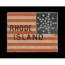 31 STARS ARRANGED IN A RARE VARIATION OF THE “GREAT STAR” PATTERN, WITH THE WORDS "RHODE ISLAND" PAINTED IN THE STRIPES, PART OF A SERIES OF THESE FLAGS, THOUGHT TO HAVE BEEN USED AT THE WIGWAM CONVENTION (THE 1860 REPUBLICAN NATIONAL CONVENTION) IN C