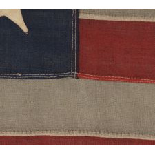 13 STARS ARRANGED IN A 3-2-3-2-3 LINEAL CONFIGURATION ON A SMALL-SCALE ANTIQUE AMERICAN FLAG MADE DURING THE FIRST HALF OF THE 1890's