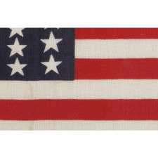 39 STARS ON A FLAG WITH AN UNUSUALLY ELONGATED FORMAT AND TWO SIZES OF STARS IN ALTERNATING COLUMNS, MADE IN 1876 IN ANTICIPATION OF THE ADDITION OF COLORADO AND THE DAKOTA TERRITORY, NEVER AN OFFICIAL STAR COUNT