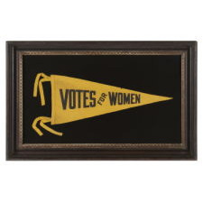 TRIANGULAR SUFFRAGETTE PENNANT WITH TEXT THAT READS: "VOTES FOR WOMEN", 1910-1920