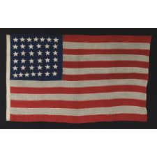 ANTIQUE 38 STAR FLAG WITH HAND-SEWN STARS, IN A SMALL SCALE AMONG PIECED-AND-SEWN EXAMPLES, WITH WONDERFUL FOLK QUALITIES, COLORADO STATEHOOD, 1876-1889