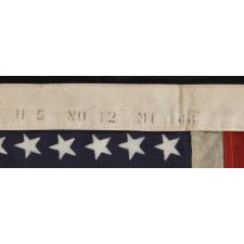 48 STAR, U.S. NAVY SMALL BOAT ENSIGN, MADE AT MARE ISLAND, CALIFORNIA DURING WWII, SIGNED AND DATED 1944, IN THE SMALLEST SCALE EMPLOYED AT THE TIME: