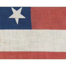 38 STARS WITH VARYING ORIENTATIONS ON AN ANTIQUE AMERICAN FLAG WITH "SQUARISH" PROPORTIONS, A LARGE AND EXTREMELY SCARCE EXAMPLE, 1876-1889, COLORADO STATEHOOD