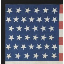 38 STARS WITH VARYING ORIENTATIONS ON AN ANTIQUE AMERICAN FLAG WITH "SQUARISH" PROPORTIONS, A LARGE AND EXTREMELY SCARCE EXAMPLE, 1876-1889, COLORADO STATEHOOD