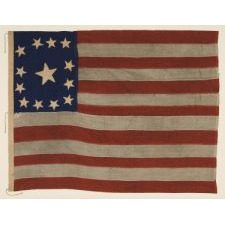 13 STARS IN A VARIATION OF A VERY RARE CONFIGURATION CALLED THE "TRUMBULL PATTERN", NAMED BECAUSE OF THE USE OF FLAGS IN THIS BASIC DESIGN-A SQUARE OF STARS SURROUNDING A SINGLE CENTER STAR-IN THREE OF JOHN TRUMBULL'S 18TH CENTURY PAINTINGS OF HIS COMMANDER, GEORGE WASHINGTON, ca 1830-1850's