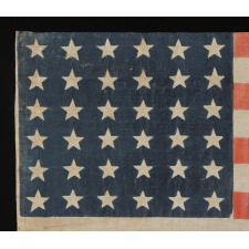 36 STAR ANTIQUE AMERICAN PARADE FLAG OF THE CIVIL WAR ERA, IN AN ESPECIALLY LARGE SCALE AND WITH BOLD COLOR, 1864-67, NEVADA STATEHOOD: