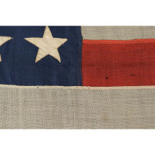 42 STARS ARRANGED IN A RARE VARIATION OF A NOTCHED DESIGN, WITH SPACES FOR 3 MORE STARS ON BOTH THE HOIST AND FLY ENDS, AN UNOFFICIAL STAR COUNT, WASHINGTON STATEHOOD, 1889-1890, SIGNED "J. & F.A. WAGNER, MAKER," CLEVELAND, OHIO