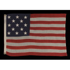 13 STARS ARRANGED IN A 3-2-3-2-3 PATTERN ON A SMALL-SCALE ANTIQUE AMERICAN FLAG MARKED "UNITED STATES ARMY STANDARD BUNTING", CA 1896 - 1908