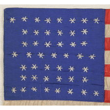 47 NEEDLEWORK STARS ON A SMALL HOMEMADE PARADE FLAG CONSTRUCTED OF SILK TAFFETA AND RIBBON, A RARE AND UNOFFICIAL STAR COUNT, NEW MEXICO STATEHOOD, 1912