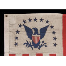 REVENUE CUTTER SERVICE ENSIGN WITH A BLUE EAGLE AMID AN ARCH OF 13 BLUE STARS, ON A WHITE FIELD, AND 16 VERTICAL RED AND WHITE STRIPES, CA 1890-1900