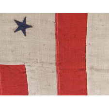 REVENUE CUTTER SERVICE ENSIGN WITH A BLUE EAGLE AMID AN ARCH OF 13 BLUE STARS, ON A WHITE FIELD, AND 16 VERTICAL RED AND WHITE STRIPES, CA 1890-1900