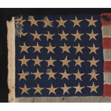 36 STARS, CIVIL WAR ERA, MADE BY ANNIN IN NEW YORK CITY, IN AN UNUSUAL TINY SIZE FOR THE PERIOD AND ENTIRELY HAND-SEWN, PROBABLY CARRIED AS A MILITARY CAMP COLORS OR GUIDON, NEVADA STATEHOOD, 1864-67