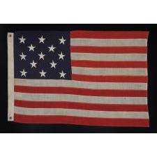 13 STARS ARRANGED IN A 3-2-3-2-3 PATTERN ON A SMALL-SCALE ANTIQUE AMERICAN FLAG MADE IN THE PERIOD BETWEEN THE LAST DECADE OF THE 19TH CENTURY AND THE FIRST QUARTER OF THE 20TH