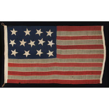 13 HUGE STARS, HAPHAZARDLY CONFIGURED IN A 4-5-4 PATTERN, ON A STRIKINGLY GRAPHIC FLAG OF THE CIVIL WAR ERA, MARKED “BIG BAY” AND PROBABLY EMPLOYED IN U.S. ARMY OR NAVY SERVICE