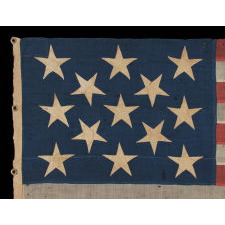 13 LARGE AND STRIKINGLY VISUAL STARS ON A U.S. NAVY SMALL BOAT ENSIGN, ENTIRELY HAND-SEWN, CA 1884-87