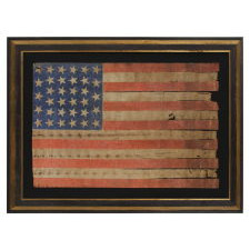 34 STARS WITH SCATTERED ORIENTATION ON A RARE, LARGE SCALE, CIVIL WAR PERIOD PARADE FLAG WITH ENDEARING WEAR FROM OBVIOUS EXTENDED USE, KANSAS STATEHOOD, 1861-63