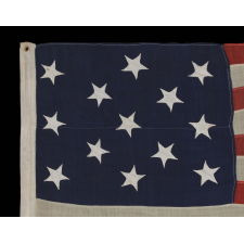 13 HAND-SEWN STARS ON AN ANTIQUE AMERICAN FLAG OF THE 1876 ERA, PROBABLY A U.S. NAVY SMALL BOAT ENSIGN