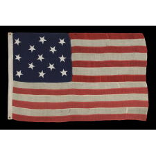 13 HAND-SEWN STARS ON AN ANTIQUE AMERICAN FLAG OF THE 1876 ERA, PROBABLY A U.S. NAVY SMALL BOAT ENSIGN