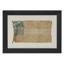 CONFEDERATE FIRST NATIONAL (STARS & BARS) PATTERN BIBLE FLAG, HANDED DOWN THROUGH THE FAMILY OF JAMES H. COOK, A MEMBER OF MORGAN’S RAIDERS; A LARGE FORMAT EXAMPLE WITH 7 STARS, IN A DISTRESSED BUT ENDEARING STATE OF PRESERVATION, PROBABLY 1861