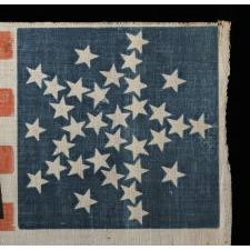 33 STARS IN AN INTERESTING VARIATION OF THE "GREAT STAR" CONFIGURATION, MADE FOR THE 1860 CAMPAIGN OF ABRAHAM LINCOLN & HANNIBAL HAMLIN, WITH WHIMSICAL SERPENTINE TEXT