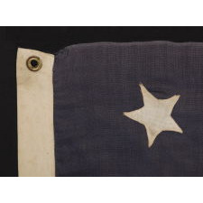 13 STARS IN A 4-5-4 PATTERN ON STONE BLUE CANTON, ON A FLAG WITH BEAUTIFUL ELONGATED PROPORTIONS, MADE BETWEEN 1876 AND THE EARLY 1890’s