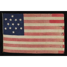 ENTIRELY HAND-SEWN 13 STAR FLAG WITH A 6-POINTED GREAT STAR / STAR OF DAVID PATTERN, ONE OF A TINY HANDFUL OF PIECED-AND-SEWN EXAMPLES WITH THIS EXTRAORDINARILY RARE STAR DESIGN, MADE DURING THE CIVIL WAR ERA (1861-65), WITH ENDEARING GRAPHICS, WEAR, AND EARLY REPAIRS: