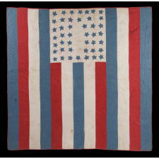 AMERICAN PATRIOTIC FLAG QUILT WITH 44 BLUE STARS SET UPON A WHITE GROUND IN THE TOP CENTER OF 13 RED, WHITE, AND BLUE STRIPES, 1890-1896, WYOMING STATEHOOD