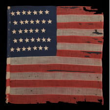 WOOL, CIVIL WAR, UNION INFANTRY BATTLE FLAG WITH 34 STARS AND EXCEPTIONAL PRESENTATION FROM HAVING BEEN EXTENSIVELY CARRIED, ACCOMPANIED BY ITS ORIGINAL STAFF, 1861-1863