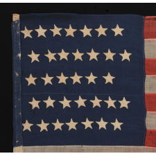 WOOL, CIVIL WAR, UNION INFANTRY BATTLE FLAG WITH 34 STARS AND EXCEPTIONAL PRESENTATION FROM HAVING BEEN EXTENSIVELY CARRIED, ACCOMPANIED BY ITS ORIGINAL STAFF, 1861-1863