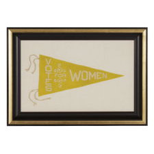 TRIANGULAR FELT SUFFRAGETTE PENNANT WITH AN INTERESTING DESIGN AND TEXT THAT READS: "VOTES FOR WOMEN", AN UNUSUAL COLOR VARIANT OF THIS STYLE, 1910-1920