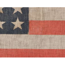 38 STARS ON AN ANTIQUE AMERICAN FLAG, MADE DURING THE PERIOD WHEN COLORADO WAS THE MOST RECENT STATE ADDED TO THE UNION, 1876-1889