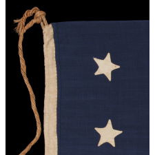 ENTIRELY HAND-SEWN, 13 STAR, U.S. NAVY SMALL BOAT ENSIGN WITH A 4-5-4 CONFIGURATION, MADE SOMETIME BETWEEN 1850 AND THE OPENING YEARS OF THE CIVIL WAR (1861-63)