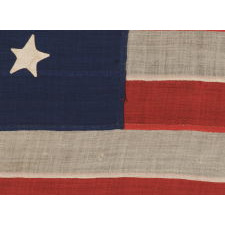 ENTIRELY HAND-SEWN, 13 STAR, U.S. NAVY SMALL BOAT ENSIGN WITH A 4-5-4 CONFIGURATION, MADE SOMETIME BETWEEN 1850 AND THE OPENING YEARS OF THE CIVIL WAR (1861-63)