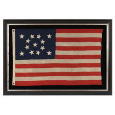 13 HAND-SEWN STARS IN A BEAUTIFUL MEDALLION CONFIGURATION ON A SMALL SCALE ANTIQUE AMERICAN FLAG OF THE 1876 CENTENNIAL ERA