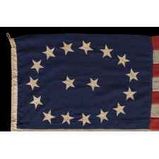 17 STARS IN AN OVAL MEDALLION WITH 2 STARS IN THE CENTER, A MID-19TH CENTURY FLAG WITH A RARE STAR COUNT, IN AN EXTRAORDINARY CONFIGURATION, AND IN A DESIRABLE SMALL SCALE AMONG ITS COUNTERPARTS OF THE PERIOD; MADE CA 1850-1865, LIKELY TO COMMEMORATE OHIO AS THE 17TH STATE