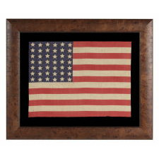 42 STARS IN A WAVE CONFIGURATION ON AN ANTIQUE AMERICAN FLAG, NEVER AN OFFICIAL STAR COUNT, 1889-1890, WASHINGTON STATEHOOD