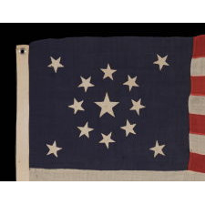13 STARS IN A MEDALLION CONFIGURATION ON A SMALL-SCALE ANTIQUE AMERICAN FLAG OF THE 1895-1920’s ERA