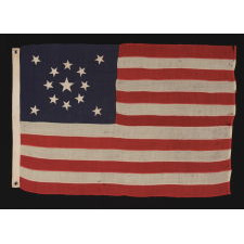 13 STARS IN A MEDALLION CONFIGURATION ON A SMALL-SCALE ANTIQUE AMERICAN FLAG OF THE 1895-1920’s ERA