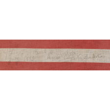 44 STARS IN A NOTCHED PATTERN ON A LARGE AMERICAN PARADE FLAG WITH A PENCILED INSCRIPTION FROM A CELEBRATION OF JULY 4TH IN NORTH DAKOTA, 1890-1896, REFLECTS WYOMING STATEHOOD, EX-RICHARD PIERCE COLLECTION