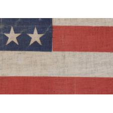 44 STARS IN A NOTCHED PATTERN ON A LARGE AMERICAN PARADE FLAG WITH A PENCILED INSCRIPTION FROM A CELEBRATION OF JULY 4TH IN NORTH DAKOTA, 1890-1896, REFLECTS WYOMING STATEHOOD, EX-RICHARD PIERCE COLLECTION