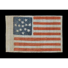 RARE 13 STAR PARADE FLAG DATING TO THE CIVIL WAR PERIOD (1861-65) OR PRIOR, WITH AN EXCEPTIONALLY RARE AND BEAUTIFUL SNOWFLAKE MEDALLION CONFIGURATION OF 13 STARS