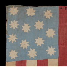EXTRAORDINARY, HAND-SEWN, 13 STAR AMERICAN NATIONAL FLAG WITH 8-POINTED STARS ON A GLAZED COTTON, CORNFLOWER BLUE CANTON, 12 STRIPES, AND ITS CANTON RESTING ON THE WAR STRIPE, FOUND IN UPSTATE, NEW YORK, PRE-CIVIL WAR, CA 1830-1850