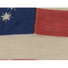 ANTIQUE AMERICAN FLAG WITH 10-POINTED STARS THAT SPELL "1776-1876", MADE FOR THE 100-YEAR ANNIVERSARY OF AMERICAN INDEPENDENCE, ONE OF THE MOST GRAPHIC OF ALL EARLY EXAMPLES