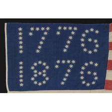 ANTIQUE AMERICAN FLAG WITH 10-POINTED STARS THAT SPELL "1776-1876", MADE FOR THE 100-YEAR ANNIVERSARY OF AMERICAN INDEPENDENCE, ONE OF THE MOST GRAPHIC OF ALL EARLY EXAMPLES