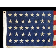 UNUSUAL ANTIQUE AMERICAN FLAG WITH 38 STARS ON A PAINT-PRINTED CANTON, ADJOINED TO 13 PIECED-AND-SEWN STRIPES, 1876-1889, COLORADO STATEHOOD