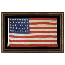 UNUSUAL ANTIQUE AMERICAN FLAG WITH 38 STARS ON A PAINT-PRINTED CANTON, ADJOINED TO 13 PIECED-AND-SEWN STRIPES, 1876-1889, COLORADO STATEHOOD