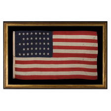 38 STARS IN A "NOTCHED" PATTERN ON A CLAMP-DYED AMERICAN FLAG OF THE 1876-1889 PERIOD, REFLECTS COLORADO STATEHOOD, MADE BY THE U.S. BUNTING COMPANY IN LOWELL, MASSACHUSETTS​