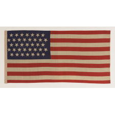37 STARS IN A "DANCING" OR "TUMBLING" ORIENTATION ON AN ANTIQUE AMERICAN FLAG WITH ELONGATED PROPORTIONS, NEBRASKA STATEHOOD, 1867-1876, THE ERA OF AMERICAN RECONSTRUCTION