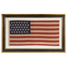 37 STARS IN A "DANCING" OR "TUMBLING" ORIENTATION ON AN ANTIQUE AMERICAN FLAG WITH ELONGATED PROPORTIONS, NEBRASKA STATEHOOD, 1867-1876, THE ERA OF AMERICAN RECONSTRUCTION